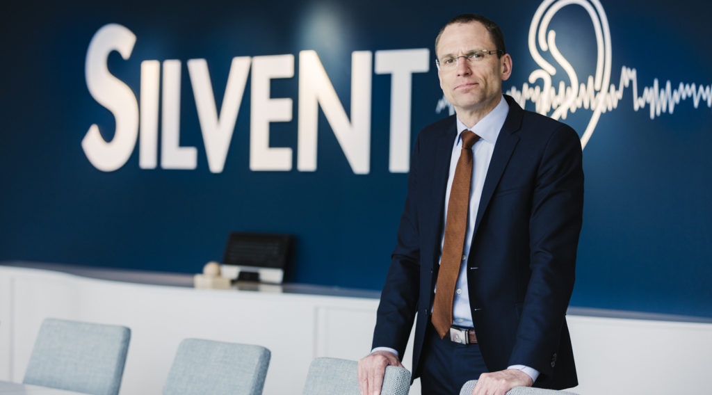 Silvents VD standing in front of Silvent logo.